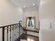 Staircase landing with bench seating and window views at 18521 Wayne Rd, Odessa, FL 33556