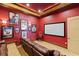 Home theater with large screen, comfortable seating, and themed decor at 18521 Wayne Rd, Odessa, FL 33556