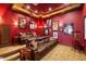 Home theater featuring tiered seating, projector, and movie posters at 18521 Wayne Rd, Odessa, FL 33556