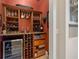 Well-equipped wine cellar with custom storage, countertop, and beverage refrigerator at 18521 Wayne Rd, Odessa, FL 33556