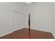 Spacious bedroom with hardwood floors, closet, ceiling fan, and neutral wall colors at 19206 Ivy Oak Way, Tampa, FL 33647