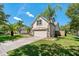 Two-story home featuring a lush lawn and large driveway leading to a two-car garage at 19206 Ivy Oak Way, Tampa, FL 33647