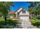 Well-maintained two-story home with lush lawn and beautiful palm trees at 19206 Ivy Oak Way, Tampa, FL 33647
