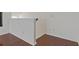 Hallway featuring hardwood floors and white trim at 19206 Ivy Oak Way, Tampa, FL 33647