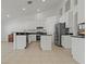 Bright and airy kitchen with sleek white cabinetry and stainless steel appliances at 19206 Ivy Oak Way, Tampa, FL 33647
