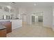 Open floor plan with large sliders and tile flooring throughout living areas at 19206 Ivy Oak Way, Tampa, FL 33647