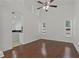 Living room featuring hardwood floors, tall ceilings, and natural light at 19206 Ivy Oak Way, Tampa, FL 33647