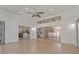 Bright living room features laminate floors, high ceilings with a fan, and sliding glass doors at 19206 Ivy Oak Way, Tampa, FL 33647