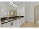 Well-lit main bathroom with double sinks and walk-in shower at 19206 Ivy Oak Way, Tampa, FL 33647