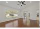Main bedroom with hardwood floors, ceiling fan and large slider to lanai at 19206 Ivy Oak Way, Tampa, FL 33647