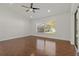 Spacious main bedroom with hardwood floors, large window and ceiling fan at 19206 Ivy Oak Way, Tampa, FL 33647