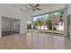 Bright sunroom features light floors and several windows for natural light to fill the room at 19206 Ivy Oak Way, Tampa, FL 33647