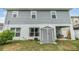 Exterior view of the back of the house with a shed, patio and backyard at 2073 Branding Iron Way, New Port Richey, FL 34655