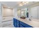 Bathroom boasts double sinks with tiled backsplash and a separate bathtub at 2073 Branding Iron Way, New Port Richey, FL 34655