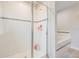 Shower with tile surround and glass door next to bathtub at 2073 Branding Iron Way, New Port Richey, FL 34655