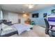 Bedroom featuring carpet flooring, a TV, and a desk at 2073 Branding Iron Way, New Port Richey, FL 34655
