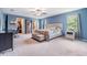 Spacious bedroom with large windows, walk-in closet, and neutral carpeting at 2073 Branding Iron Way, New Port Richey, FL 34655