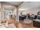 An open concept dining room leading into the kitchen with hardwood flooring at 2073 Branding Iron Way, New Port Richey, FL 34655
