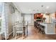 Bright kitchen and dining area with natural light, tile floors, and a modern design at 2073 Branding Iron Way, New Port Richey, FL 34655
