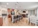 Open kitchen and living area with island seating, stainless appliances, and seamless flow for entertaining at 2073 Branding Iron Way, New Port Richey, FL 34655