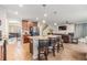 Spacious kitchen with granite island, bar stool seating, and open layout to the living area at 2073 Branding Iron Way, New Port Richey, FL 34655