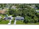 Beautiful aerial view of home with lush greenery, solar panels, and well-maintained landscaping at 22442 Vale Ave, Punta Gorda, FL 33980