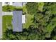 Aerial view of a home with lush greenery and a well-maintained roof at 22442 Vale Ave, Punta Gorda, FL 33980