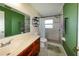 Bathroom highlighting a vanity with drawers and a mirror and shower, with a tiled shower and modern fixtures at 22442 Vale Ave, Punta Gorda, FL 33980