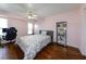 Stylish bedroom with hardwood floors, a display case, and a comfortable bed, providing a chic and relaxing atmosphere at 22442 Vale Ave, Punta Gorda, FL 33980