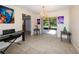 Charming dining area featuring modern light fixtures, stylish decor, and access to the lanai at 22442 Vale Ave, Punta Gorda, FL 33980