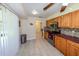 Spacious kitchen features a tile backsplash, stainless steel appliances, and a large countertop at 22442 Vale Ave, Punta Gorda, FL 33980