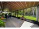 Enclosed patio with view of backyard at 22442 Vale Ave, Punta Gorda, FL 33980