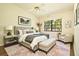 Serene main bedroom with a comfortable bed, stylish decor, and plenty of natural light at 2400 Winding Creek Blvd # Bldg18A210, Clearwater, FL 33761