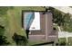 An aerial view highlighting a screened-in pool and the home's roof at 2532 Sweetgum W Way, Clearwater, FL 33761