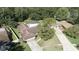 Aerial view of a single Gathering home with a screened-in pool and spacious yard at 2532 Sweetgum W Way, Clearwater, FL 33761