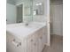 Bathroom featuring a white vanity, countertop, and mirror at 2532 Sweetgum W Way, Clearwater, FL 33761