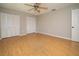 Bedroom with laminate flooring and spacious closet storage at 2532 Sweetgum W Way, Clearwater, FL 33761