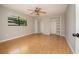 Bright bedroom featuring laminate floors, built in closet, ceiling fan and natural light at 2532 Sweetgum W Way, Clearwater, FL 33761