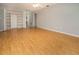 Bright, airy bedroom with laminate flooring, ceiling fan, and a built-in closet at 2532 Sweetgum W Way, Clearwater, FL 33761