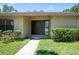 A close-up of a home's entrance featuring a double door with decorative glass and well-kept shrubs at 2532 Sweetgum W Way, Clearwater, FL 33761