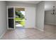 A well-lit entryway featuring tiled flooring and double doors leading to the outdoors at 2532 Sweetgum W Way, Clearwater, FL 33761