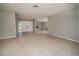 Spacious living room with neutral paint, tile floors and double doors leading to the entry at 2532 Sweetgum W Way, Clearwater, FL 33761