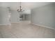 Open living area with tile floors and views of the pool area at 2532 Sweetgum W Way, Clearwater, FL 33761