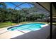 Enjoy this inviting pool in its screened enclosure with its sparkling water and shaded retreat at 2532 Sweetgum W Way, Clearwater, FL 33761