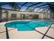 Take a dip in this screened-in pool, featuring a spacious deck and easy access to indoor and outdoor living spaces at 2532 Sweetgum W Way, Clearwater, FL 33761