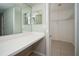 Bright vanity area features a mirror, countertop, and access to closet storage at 2532 Sweetgum W Way, Clearwater, FL 33761