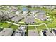 Beautiful aerial view of a Primary planned community surrounding a lake with ample green space and a pool at 31105 Mango Fade Way, San Antonio, FL 33576
