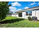 Fenced backyard with lush green grass and an open patio, perfect for entertaining at 31105 Mango Fade Way, San Antonio, FL 33576