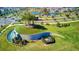 Scenic view of the community park featuring unique landscaping, mature trees, and a tranquil water feature at 31105 Mango Fade Way, San Antonio, FL 33576