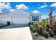Charming single-Gathering home with well-manicured landscaping and a two-car garage at 31105 Mango Fade Way, San Antonio, FL 33576
